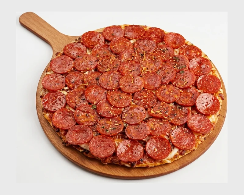 Monster Pepperoni Pizza with double cheese on a green tea crust at Pizza Maru & Katsuya, Calgary